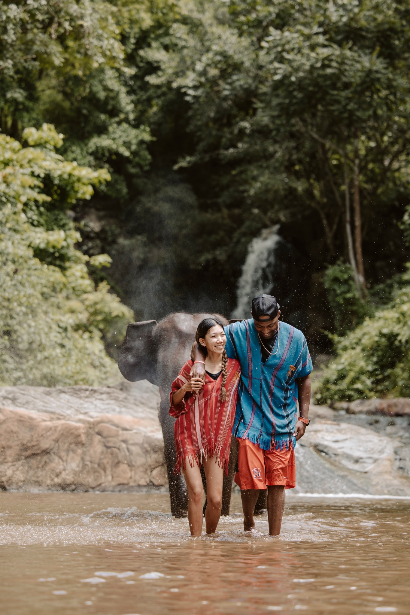 Stephanie and Quay wading together in the river