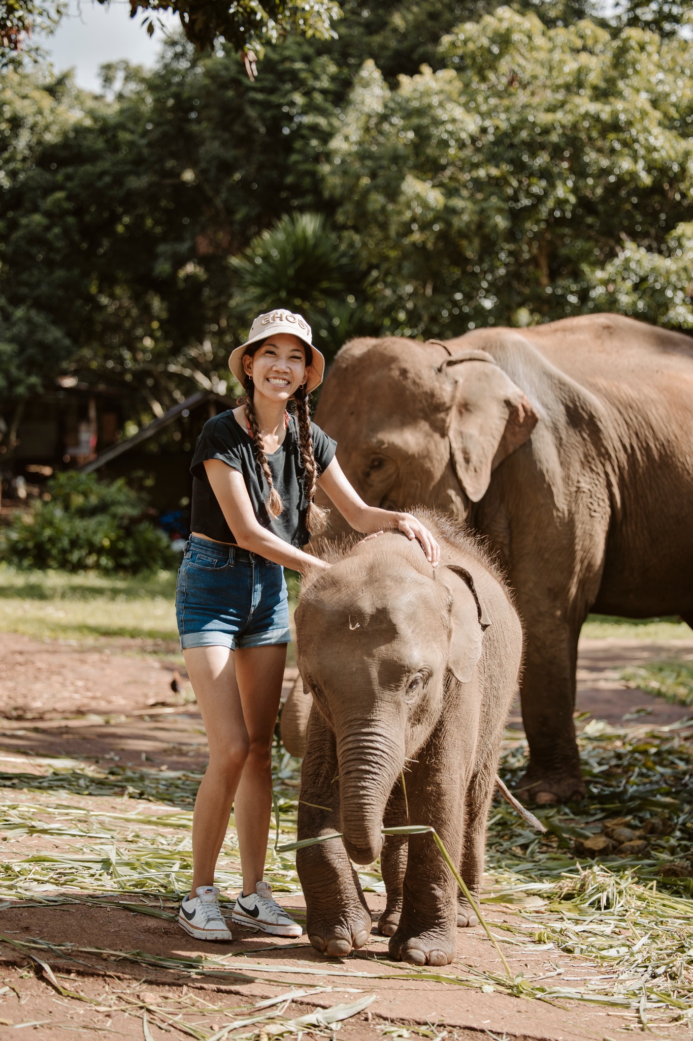 Stephanie standing beside an elephant