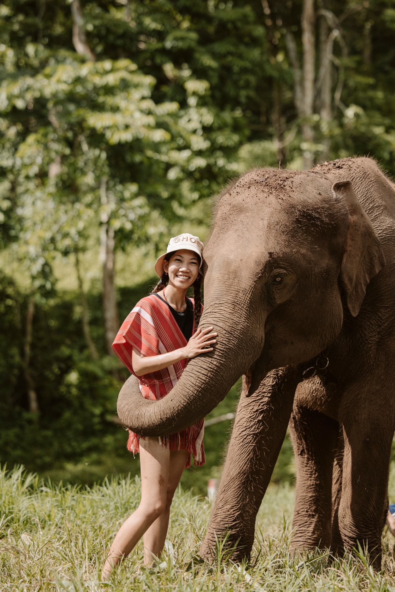 Stephanie standing beside an elephant