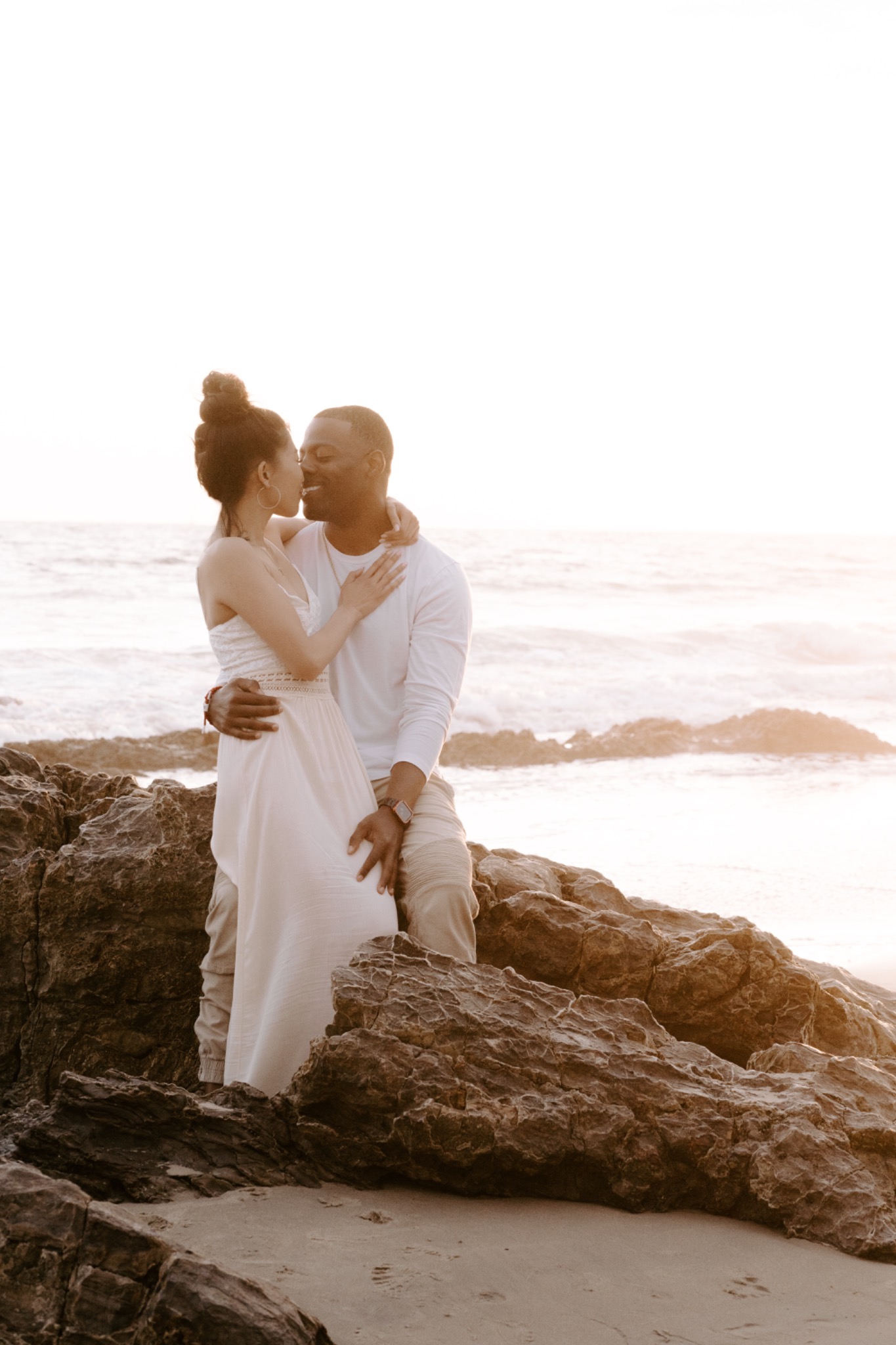 Stephanie and Quay together on coastal rocks