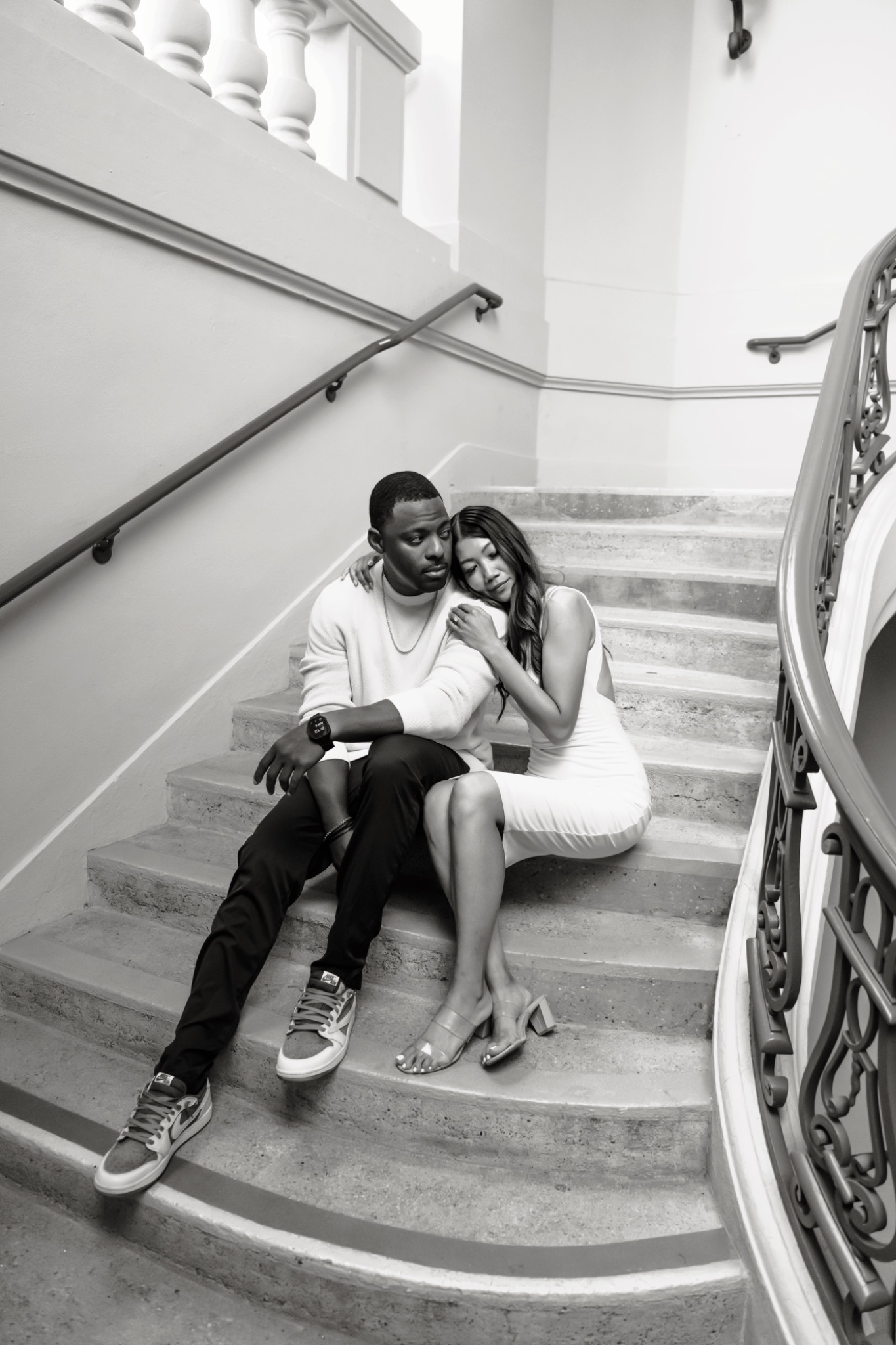 Black and white portrait of Stephanie and Quay on a stairway